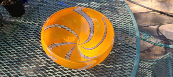 Bowl with swirl orange leaves partitioned by compl by Ronen Vainish