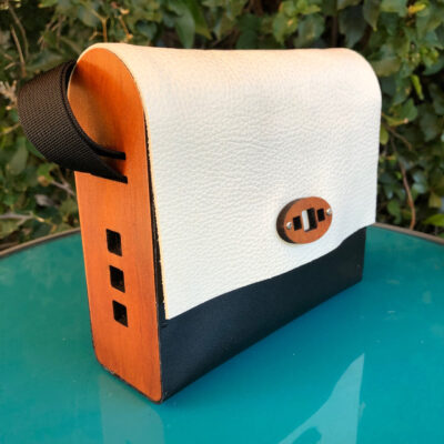 Laser-cut wood and leather bag by Kathleen Bonte