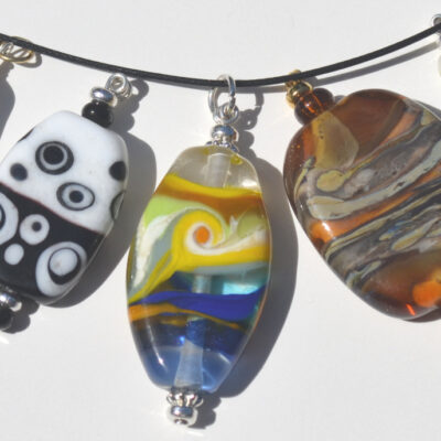 Wearable Glass Art by Noreen Rubay