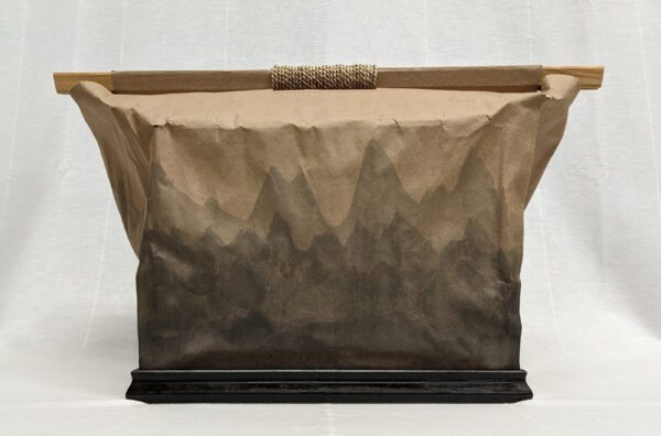 A Paper Bag Retaining the Memory of Fire Preserved by Clayton Moraga