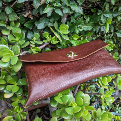 Hand made leather clutch. Curved bottom and edges by Eilish Lancaster